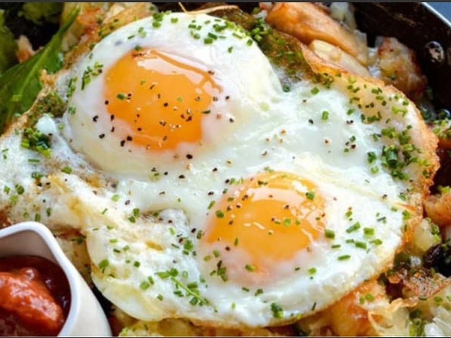 Full Fry — Firm, golden-edged fried eggs served piping hot.