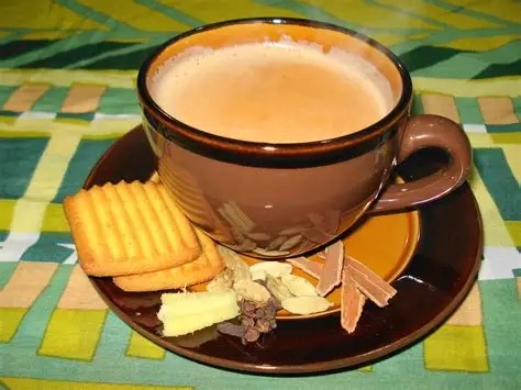 A hot cup of chai served with crunchy biscuits